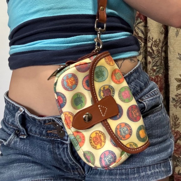 Dooney & Bourke Handbags - DOONEY & BOURKE adorable wristlet with logo design and brown leather detailing